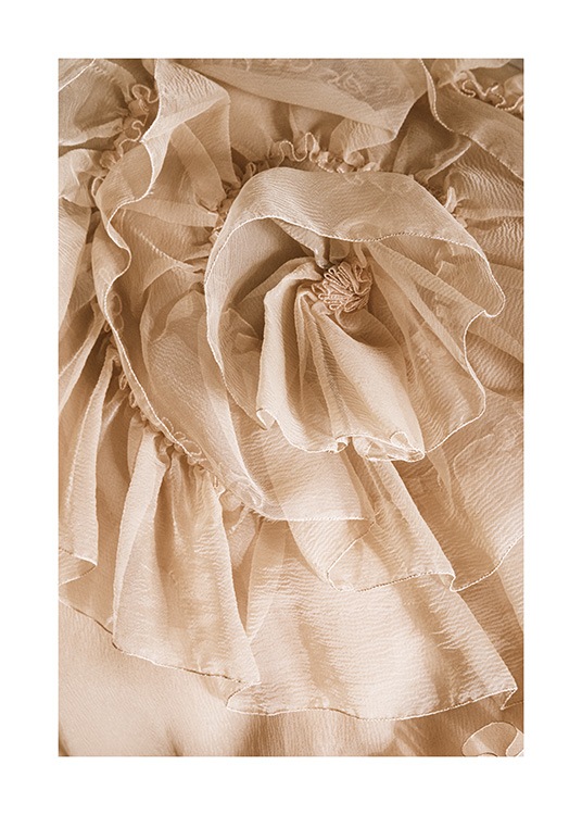  – Fotografi af tyl med flæser i beige, der ligner en blomst